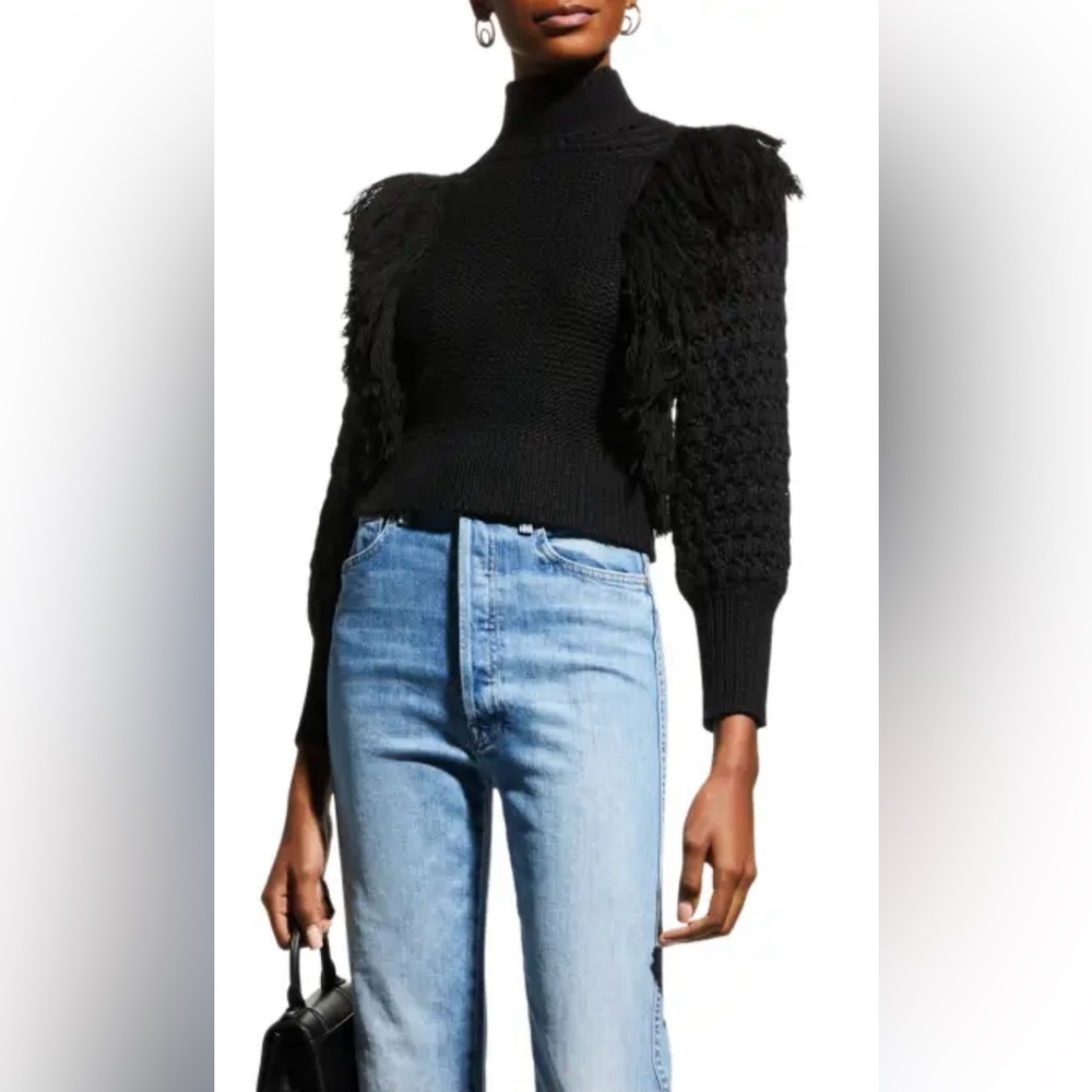 Niccolai long sleeved black sweater w  crew neck and fringe on sleeves. Small
